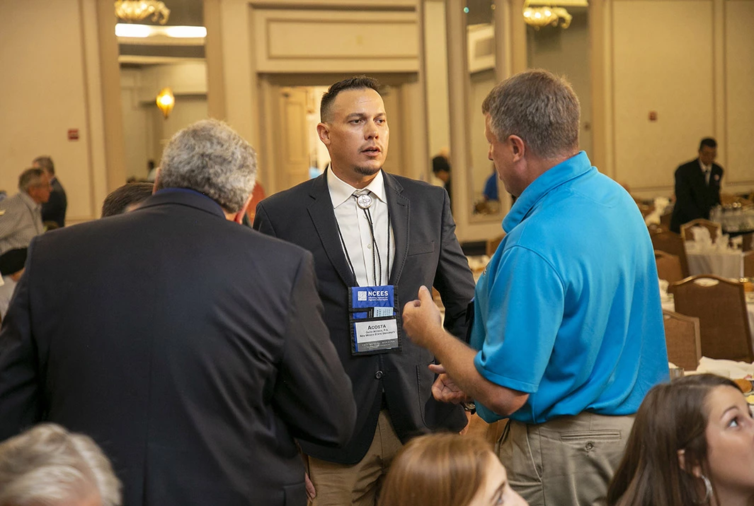 David Acosta at a conference talking to people