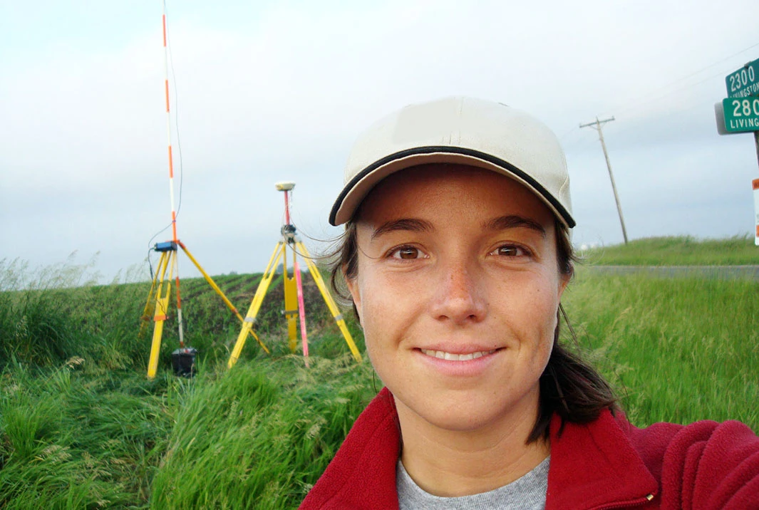 Virginia Winberg in a field with tripods