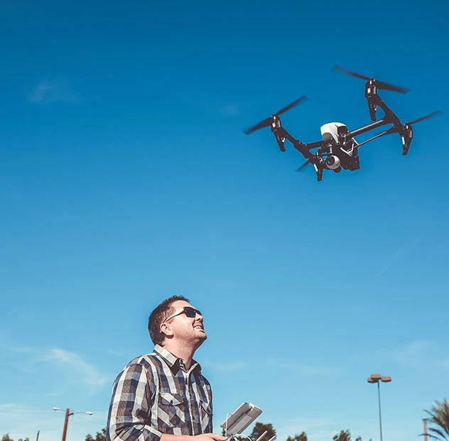 young man flying a drone